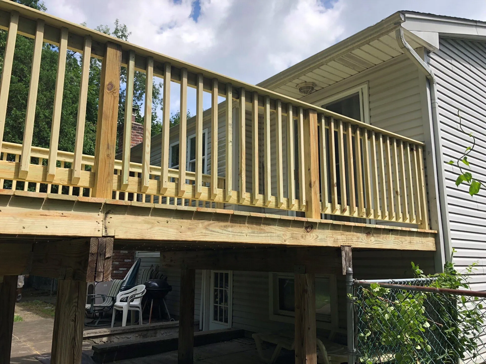 Outdoor living deck with railing